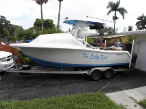 White Tidewater boat on trailer.