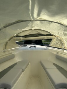 Interior of a small boat with canopy.
